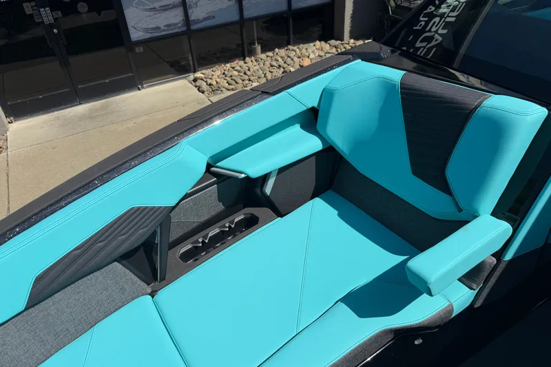 Slide: The Image of 2026 MasterCraft X24 boat interior with turquoise and black seating. - 59