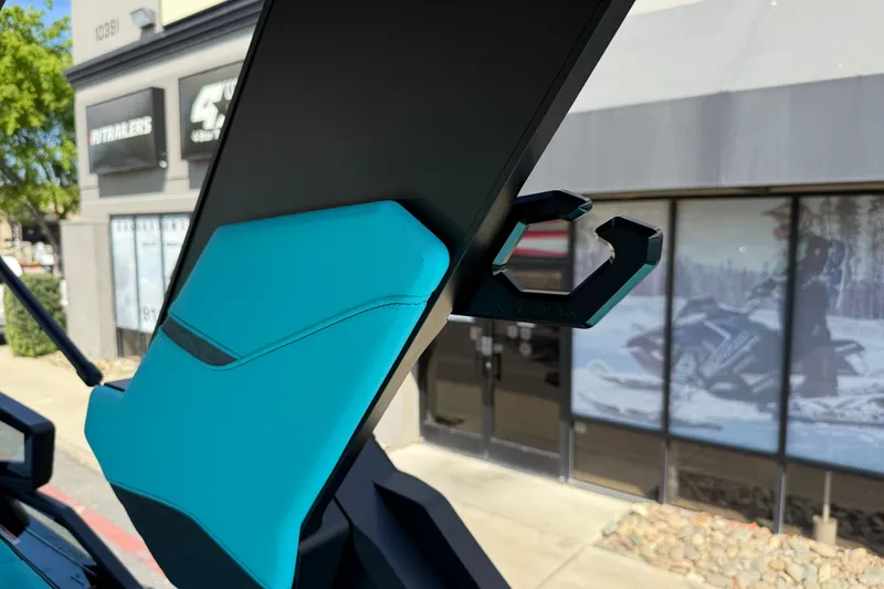 Slide: The Image of 2026 MasterCraft X24 boat with teal interior detail and accessory hook. - 61