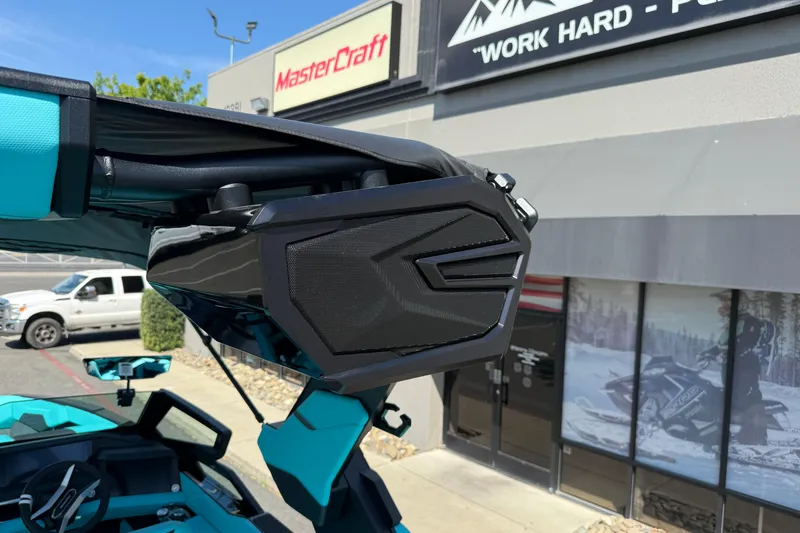 Slide: The Image of 2026 MasterCraft X24 boat speaker detail outside dealership. - 63