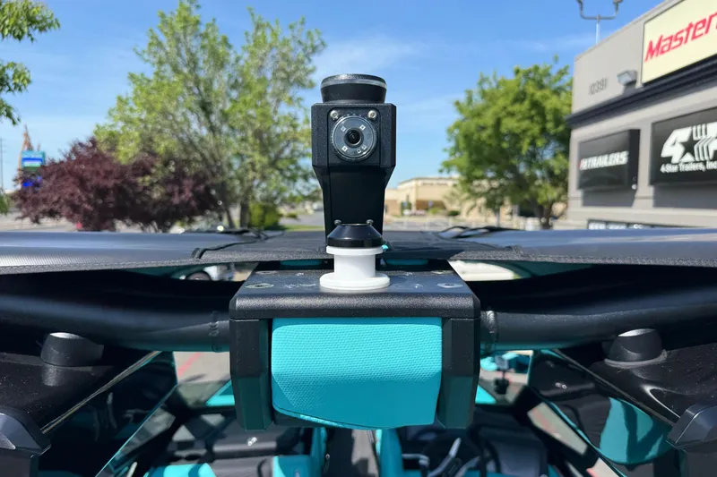 Slide: The Image of 2026 MasterCraft X24 boat camera system with blue accents, outdoor setting. - 64