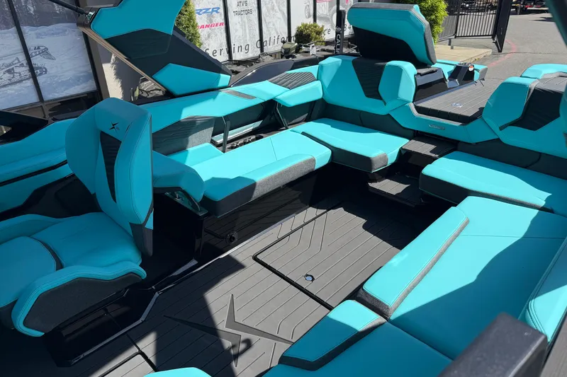 Slide: The Image of 2026 MasterCraft X24 boat interior with turquoise seating and sleek design. - 69