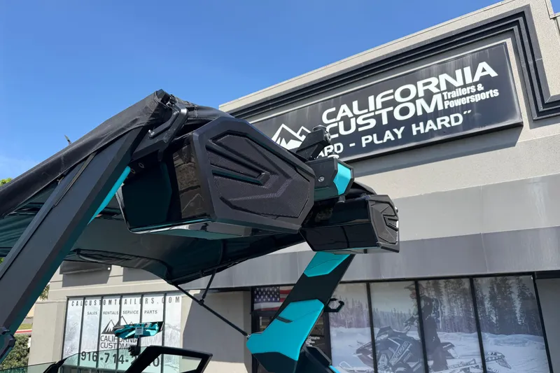 Slide: The Image of 2026 MasterCraft X24 boat with speakers at California Custom dealership. - 71