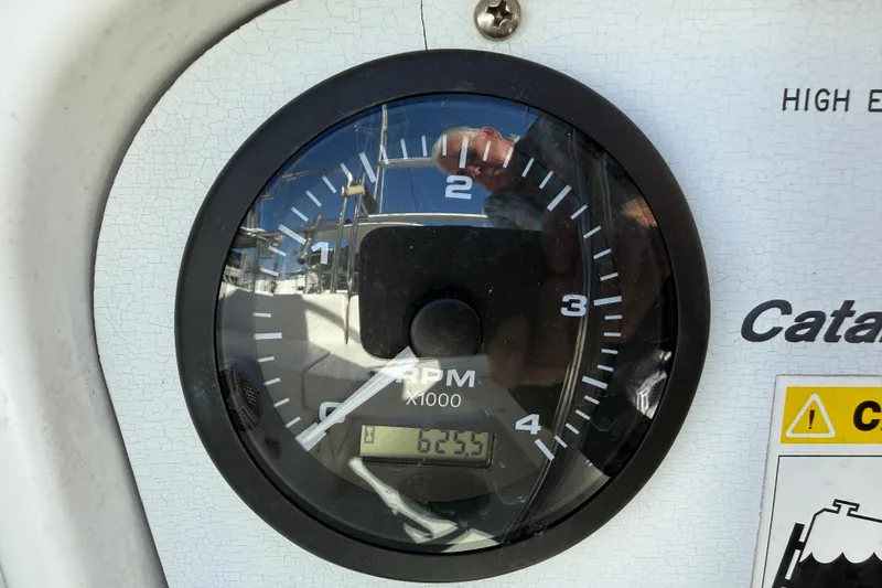 Slide: The Image of Close-up of Catalina 36 MkII 2000 RPM gauge displaying 6235 hours. - 14