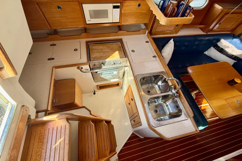Slide: The Image of Interior of 2000 Catalina 36 MkII sailboat with kitchen and dining area. - 20