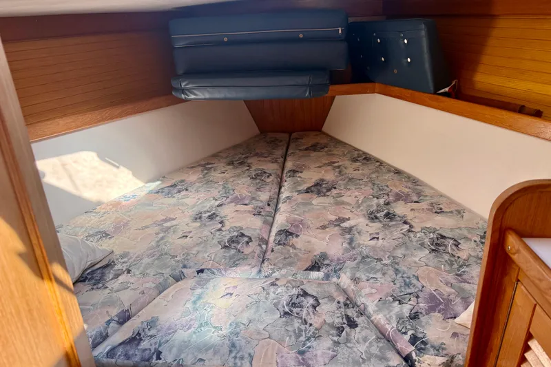 Slide: The Image of Cozy cabin interior of 2000 Catalina 36 MkII sailboat with floral-patterned bedding. - 24