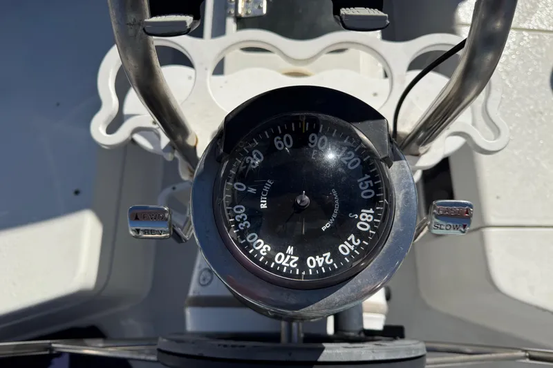 Slide: The Image of Compass and throttle controls on a 2000 Catalina 36 MkII sailboat. - 43