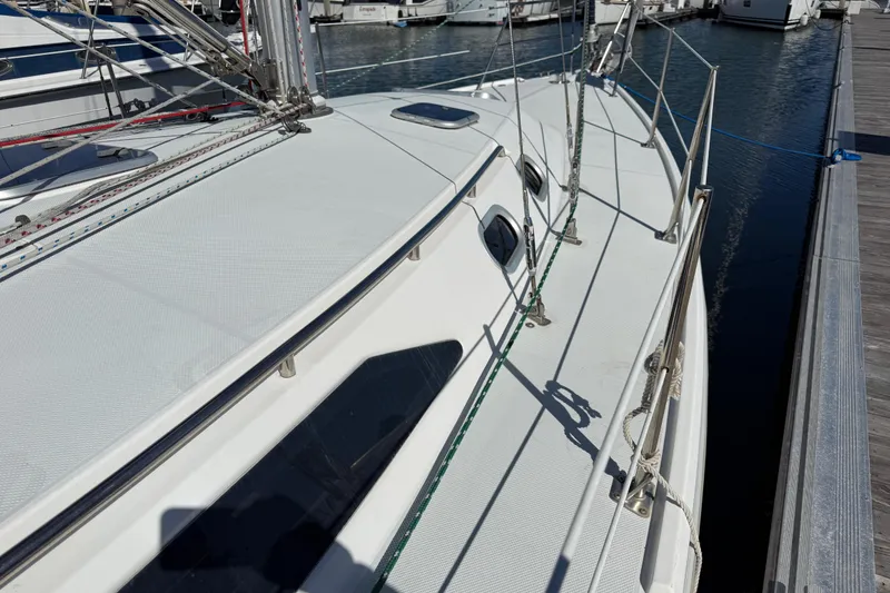Slide: The Image of Catalina 36 MkII sailboat from 2000 docked at a marina, showing deck and rigging. - 6