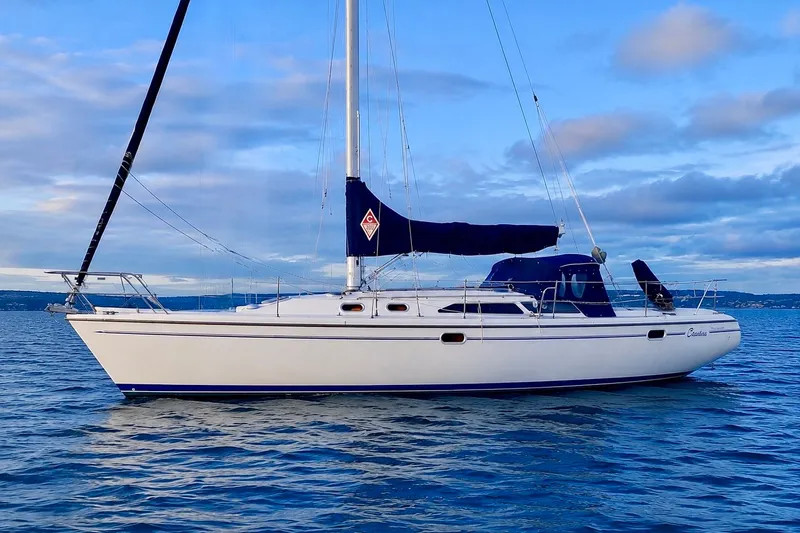 Slide: The Image of Sailboat Catalina 36 MkII 2000 on calm water under a blue sky. - 1