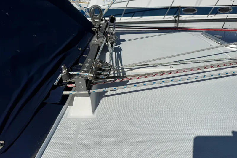 Slide: The Image of Deck rigging on a 2000 Catalina 36 MkII sailboat, featuring ropes and pulleys. - 7