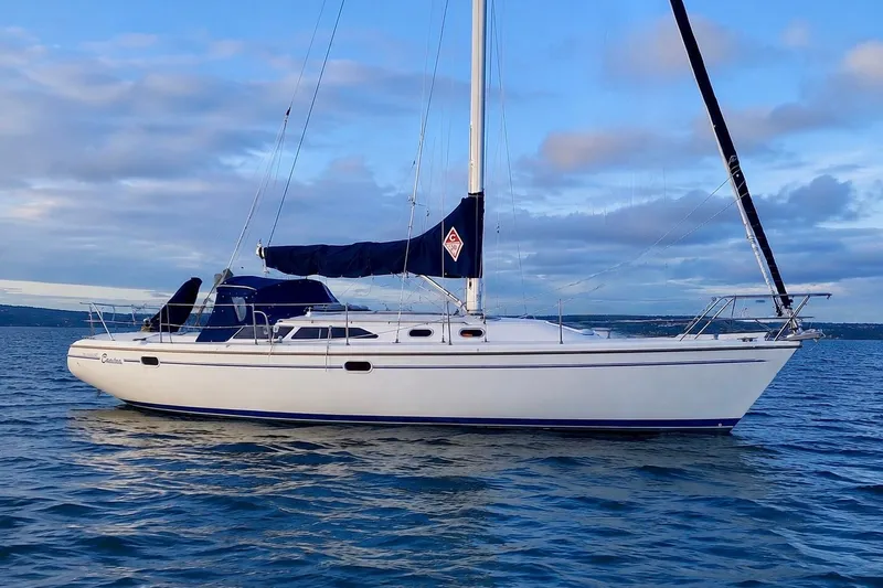 The Image of 2000 Catalina 36 MkII sailboat on calm water under a blue sky. - 0