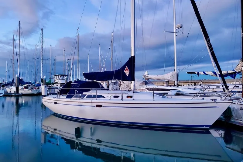 Slide: The Image of Catalina 36 MkII 2000 sailboat docked in a serene marina at sunset. - 3