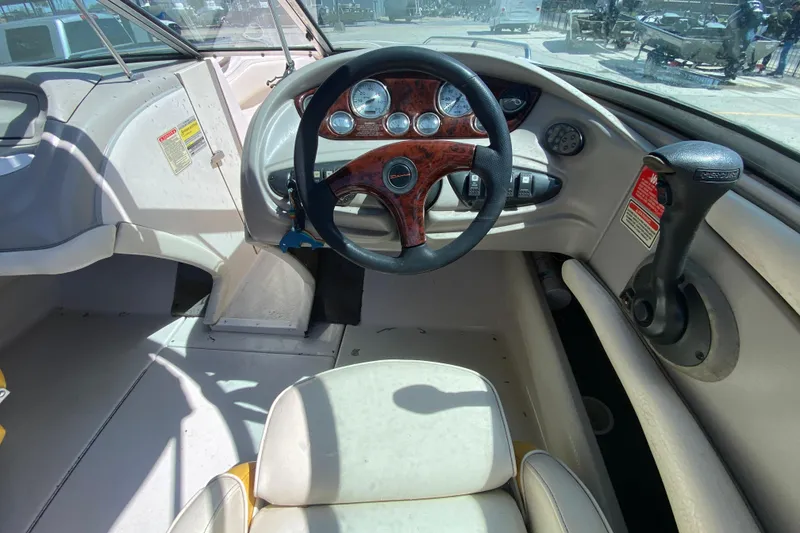 Slide: The Image of Interior view of 2003 Monterey 208SI Montura boat cockpit with steering wheel and controls. - 15