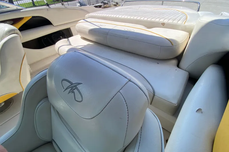 Slide: The Image of Interior of a 2003 Monterey 208SI Montura boat with white leather seating. - 17