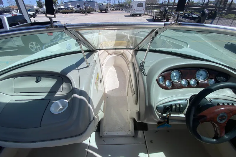 Slide: The Image of 2003 Monterey 208SI Montura boat dashboard with steering wheel and instrument panel. - 18