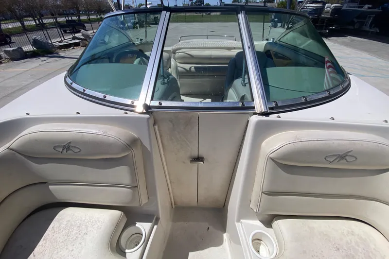 Slide: The Image of 2003 Monterey 208SI Montura boat interior with seating and windshield view. - 19