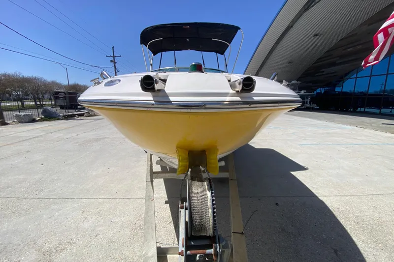 Slide: The Image of 2003 Monterey 208SI Montura boat on trailer, yellow hull, outdoor display. - 9