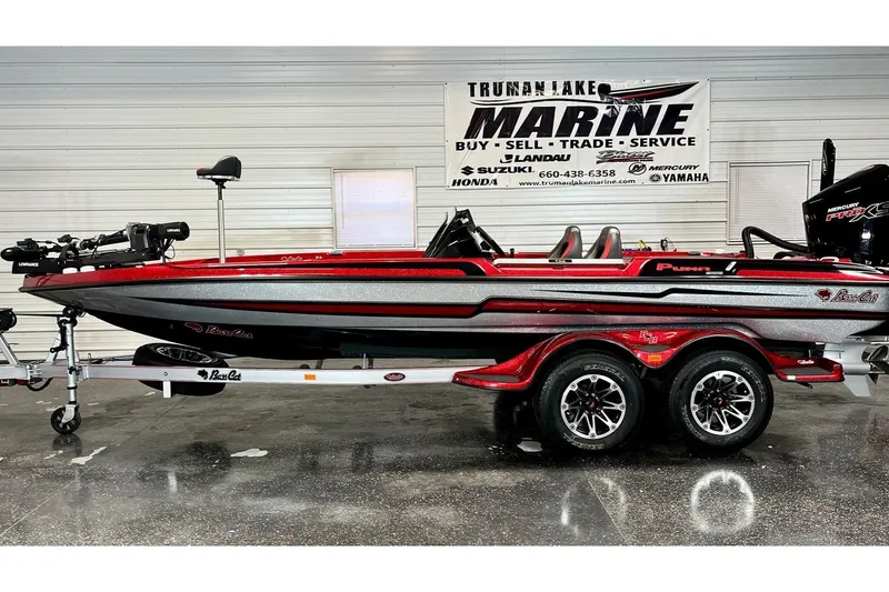 The Image of 2024 Bass Cat Puma STS boat in showroom, side view with trailer. - 0