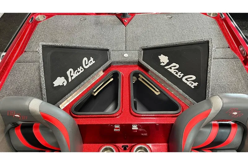 Slide: The Image of 2024 Bass Cat Puma STS boat interior with storage compartments and seating. - 10