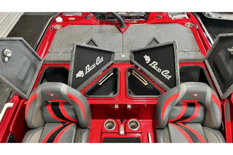 Slide: The Image of 2024 Bass Cat Puma STS boat interior with storage compartments and red-gray seats. - 11