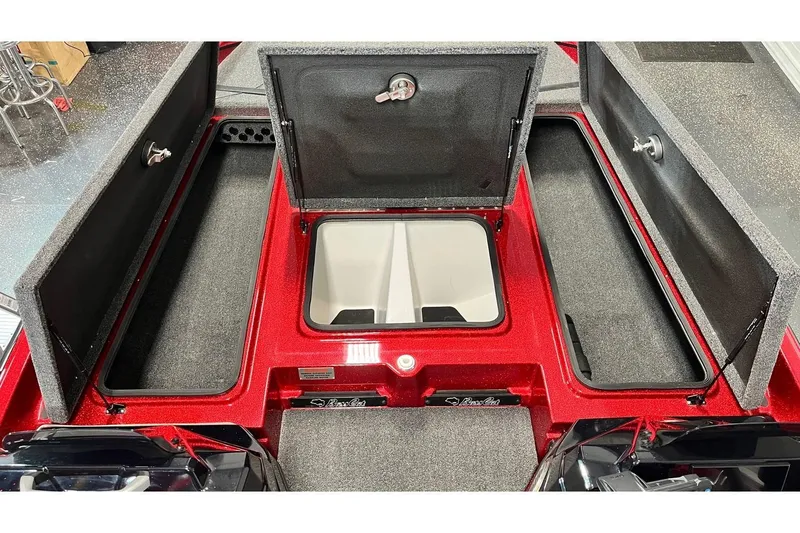Slide: The Image of 2024 Bass Cat Puma STS boat storage compartments, open and spacious, with red finish. - 12