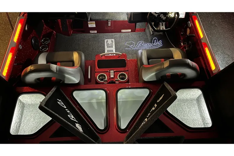 Slide: The Image of 2024 Bass Cat Puma STS interior with dual seats, storage compartments, and illuminated accents. - 15