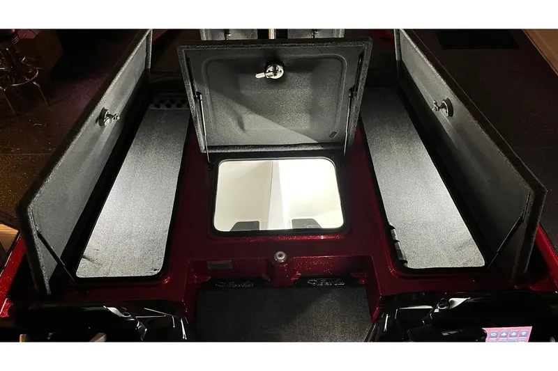 Slide: The Image of 2024 Bass Cat Puma STS boat storage compartments, open and illuminated. - 16