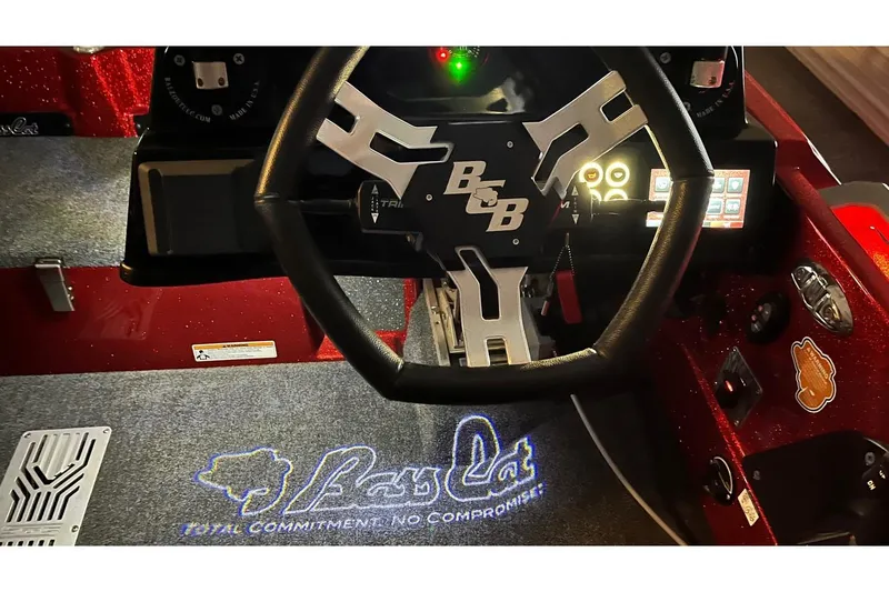 Slide: The Image of 2024 Bass Cat Puma STS steering wheel and dashboard with illuminated logo. - 17