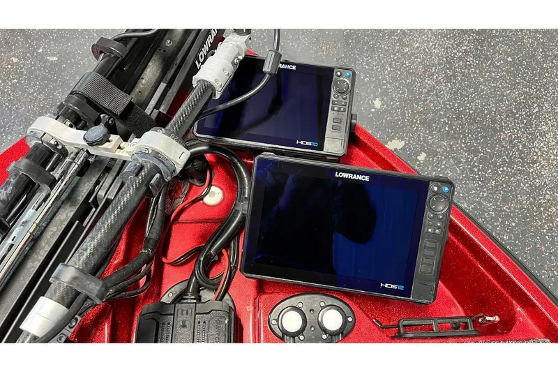 Slide: The Image of 2024 Bass Cat Puma STS boat with Lowrance HDS displays and fishing equipment. - 6