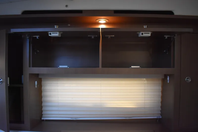 Slide: The Image of Interior cabinet and window blinds in 2016 Sea Ray Sundancer 310 yacht. - 34