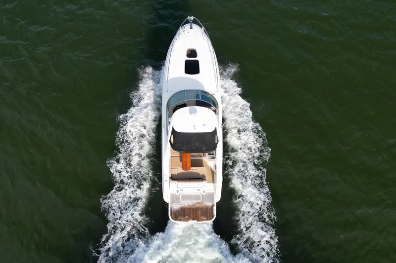 Slide: The Image of 2016 Sea Ray Sundancer 310 cruising on open water, aerial view. - 7
