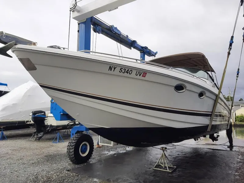 Slide: The Image of 1999 Formula 33 SS boat on a hoist. - 1