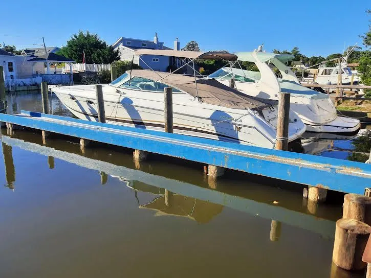 Slide: The Image of 1999 Formula 33 SS boat docked on a sunny day. - 5