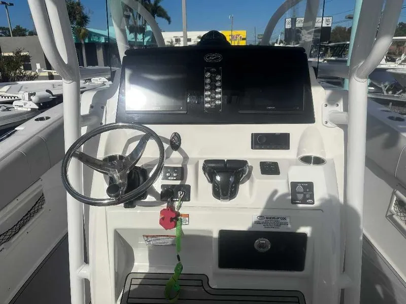 Slide: The Image of 2022 Sea Fox 268 Commander helm with steering wheel and controls. - 6
