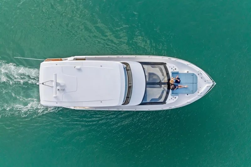 Slide: The Image of Aerial view of 2026 Cruisers Yachts 50 Fly on turquoise water. - 27