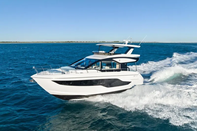 Slide: The Image of 2026 Cruisers Yachts 50 Fly cruising on open blue waters. - 37