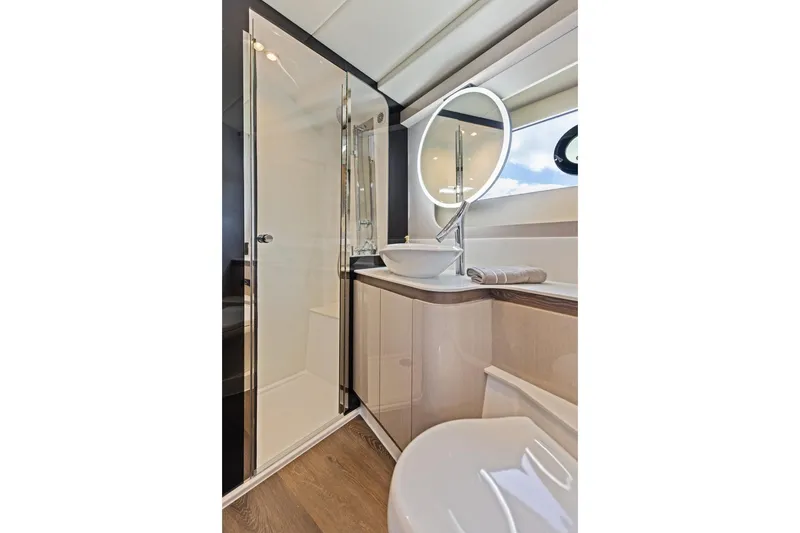 Slide: The Image of Luxurious bathroom interior of 2026 Cruisers Yachts 50 Fly with modern fixtures and elegant design. - 72