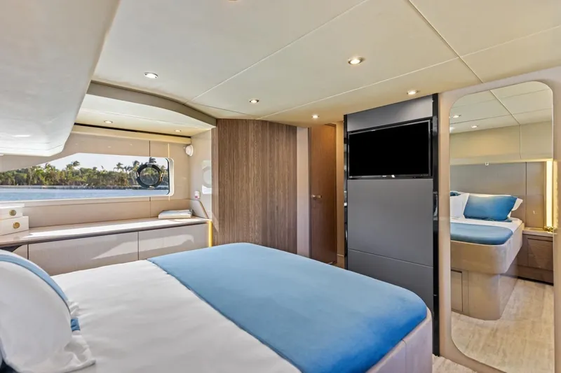 Slide: The Image of Luxurious bedroom interior of 2026 Cruisers Yachts 50 Fly with modern design and scenic window view. - 77