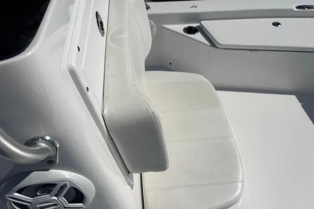 Slide: The Image of White seating area on a 2022 Frontier 2104 boat, featuring sleek design and modern fixtures. - 12