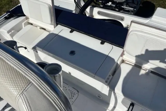 Slide: The Image of Interior of a 2022 Frontier 2104 boat, featuring seating and storage compartments. - 5
