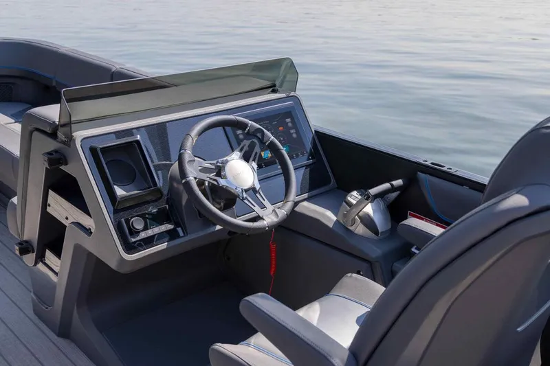 Slide: The Image of Manufacturer Provided Image: Manitou Explore Dual Engine 2025 helm on calm water. - 3