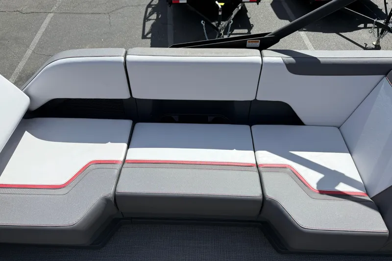 Slide: The Image of 2025 Manitou Cruise boat seating with modern design and red accents. - 14