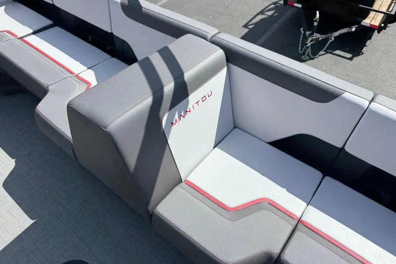 Slide: The Image of 2025 Manitou Cruise boat seating with modern design and red accents. - 16