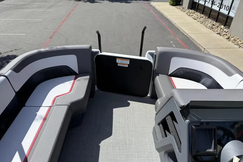 Slide: The Image of 2025 Manitou Cruise pontoon boat interior with stylish seating and modern design. - 20