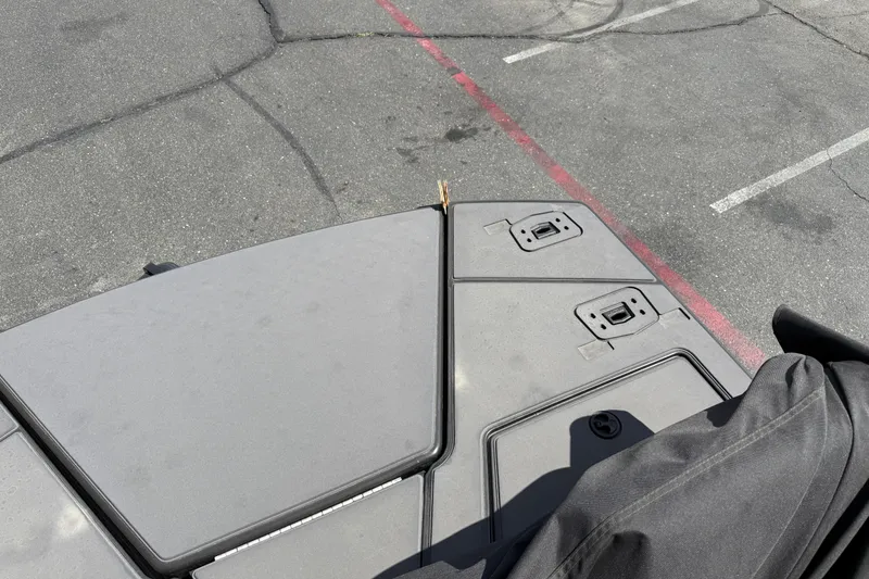 Slide: The Image of Top view of a 2025 Manitou Cruise boat deck in a parking lot. - 24