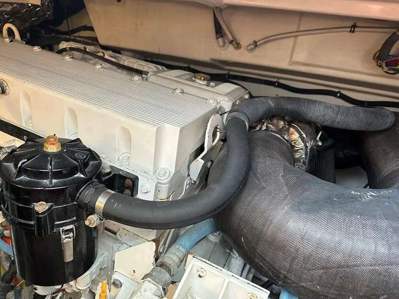Slide: The Image of Engine room of 2006 Tiara Yachts 4400 Sovran with filters and hoses. - 42