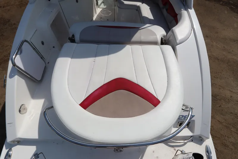 Slide: The Image of 2016 Chaparral 287 SSX boat interior with white and red seating. - 13
