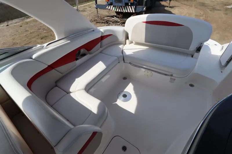Slide: The Image of 2016 Chaparral 287 SSX boat interior with white and red seating arrangement. - 16