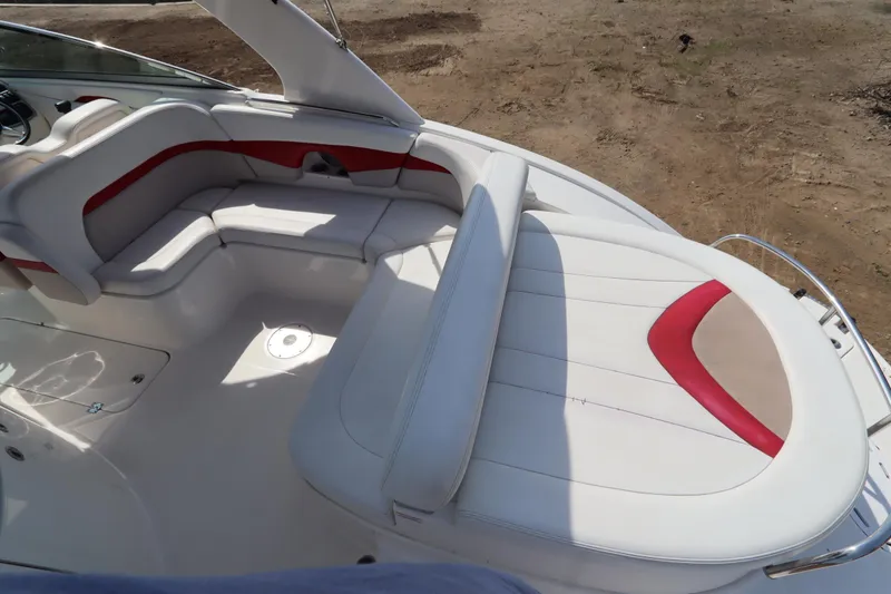 Slide: The Image of 2016 Chaparral 287 SSX boat interior with white and red seating. - 17