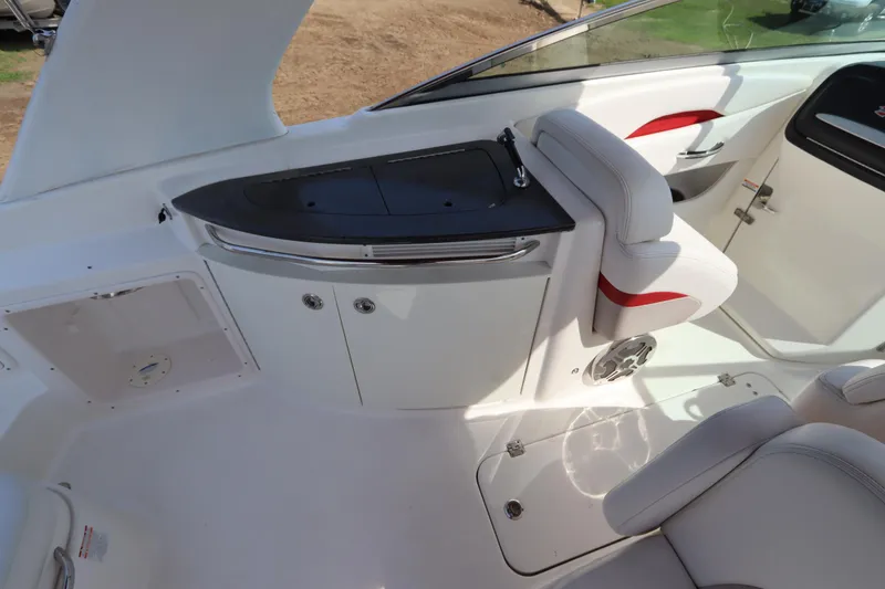 Slide: The Image of 2016 Chaparral 287 SSX boat interior with white seating and sleek design. - 18