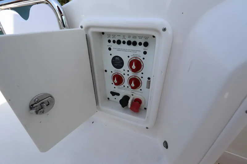 Slide: The Image of Control panel of a 2016 Chaparral 287 SSX boat with open access door. - 21